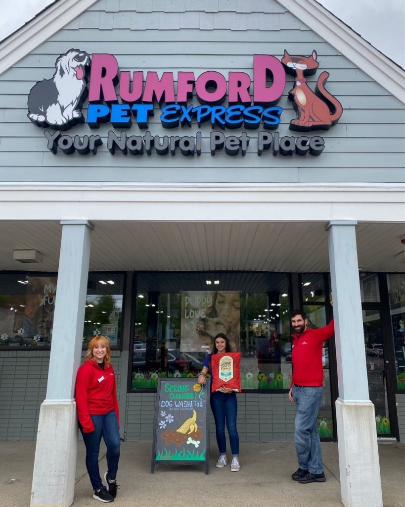 Rumford Pet Express storefront with three employees standing out front.